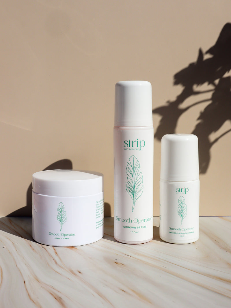 Smooth Operator Ingrown Hair Serum bottles beside a jar of Smooth Operator Pads for ingrown hairs after waxing