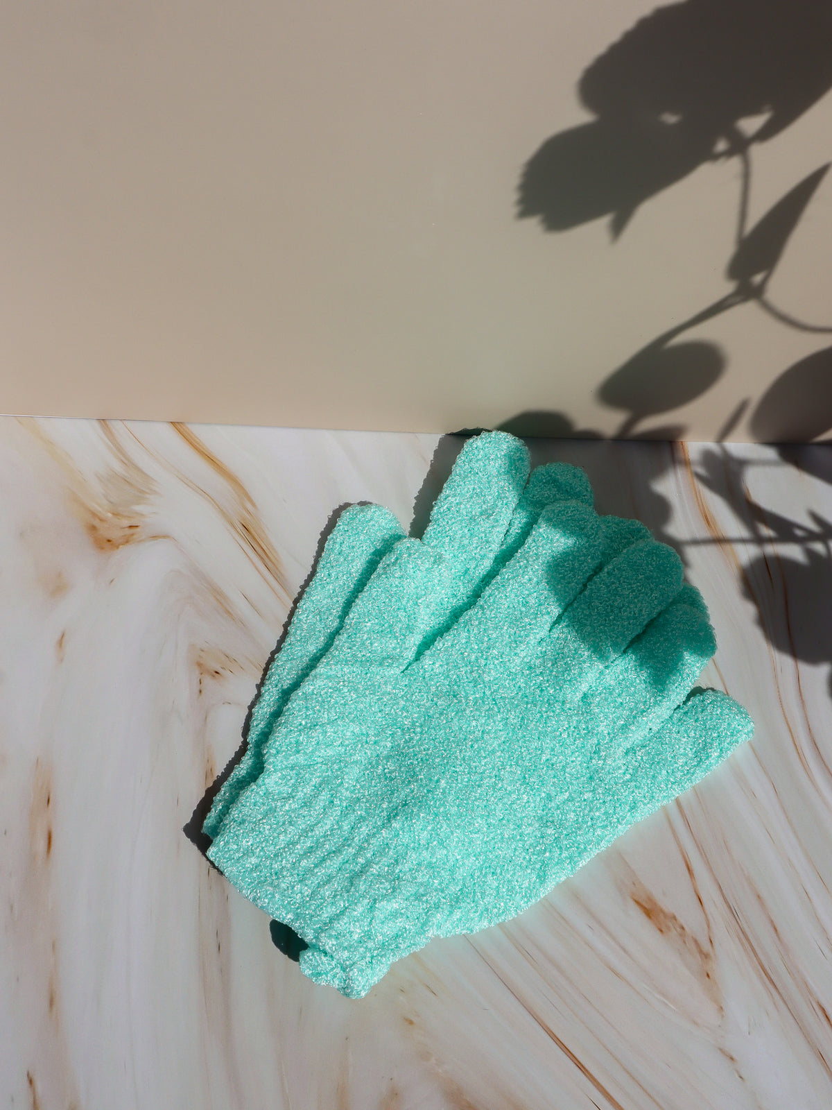 Mint green Exfoliating Glove from Just The Strip for shower exfoliation