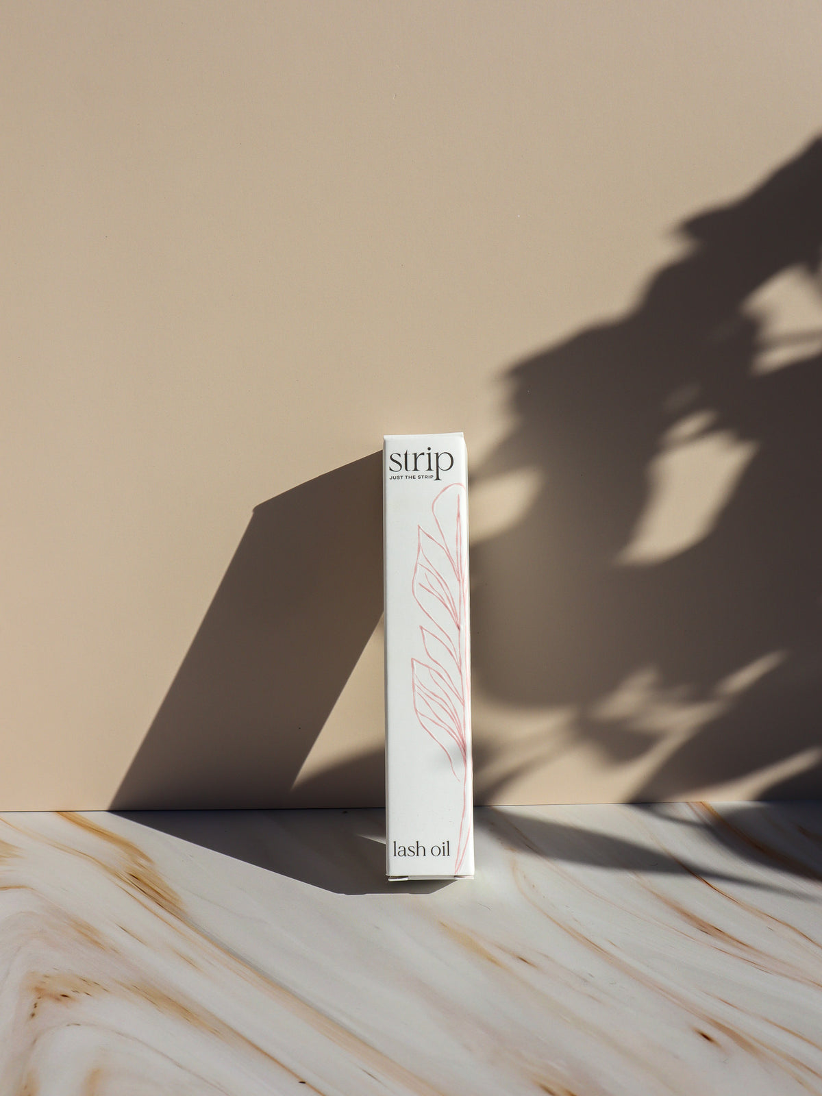 Lash Conditioning Oil in its box, nightly lash serum by Just The Strip